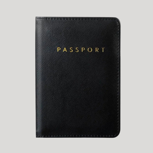 A black passport cover with a textured leather-like finish and gold embossed 'PASSPORT' lettering, shown against a solid gray background.